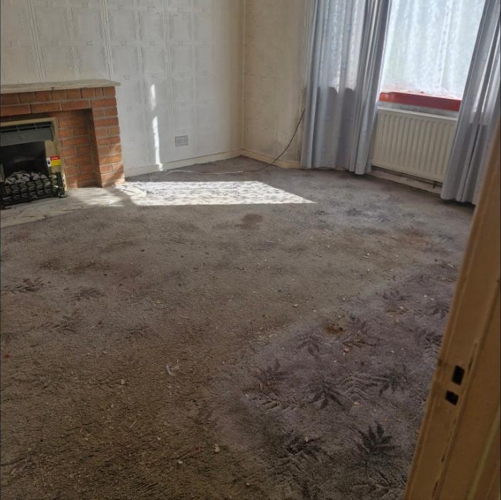 Living room fully cleared during house clearance in Airdrie, Scotland